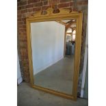 A large gilt framed mirror,