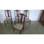 A set of four Edwardian mahogany and inlaid dining chairs