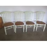A set of four modern painted dining chairs with oak seats