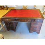 A modern mahogany nine drawer pedestal desk with a leather inset top - 80 cm tall x 152 cm x 90 cm