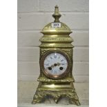 An 8 Day Brass French Mantle Clock with Gilt Hand and Dial showing hours and minutes - 14" tall