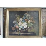 A 19th Century gilt-framed oil on canvas of a basket of mixed flowers resting on a ledge - 63cm x