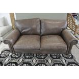 A Laura Ashley Distressed Leather Sofa - 183 cm wide - used but in good condition