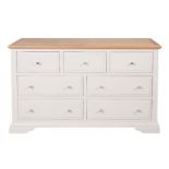 A new Aspen painted three short over four long drawer chest - finished in a mushroom colour with an