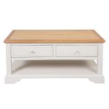 A new painted Aspen two drawer coffee table finished in a mushroom colour with an oak top - W105cm