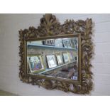 A rectangular giltwood mirror with bevelled plate, overall mirror size 79cm x 74cm,