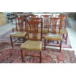 A set of 8 Arthur Brett mahogany dining chairs with leather seats - fire labels underneath - in