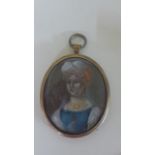 A 17th Century Continental School portrait miniature on copper of a Lady wearing a blue dress and