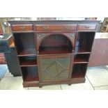 Mahogany breakfront cabinet and open shelved bookcase - three frieze drawers on a plinth base - 173