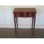 A modern side table with a serpentine front - Width 61cm x Height 77cm - in good condition