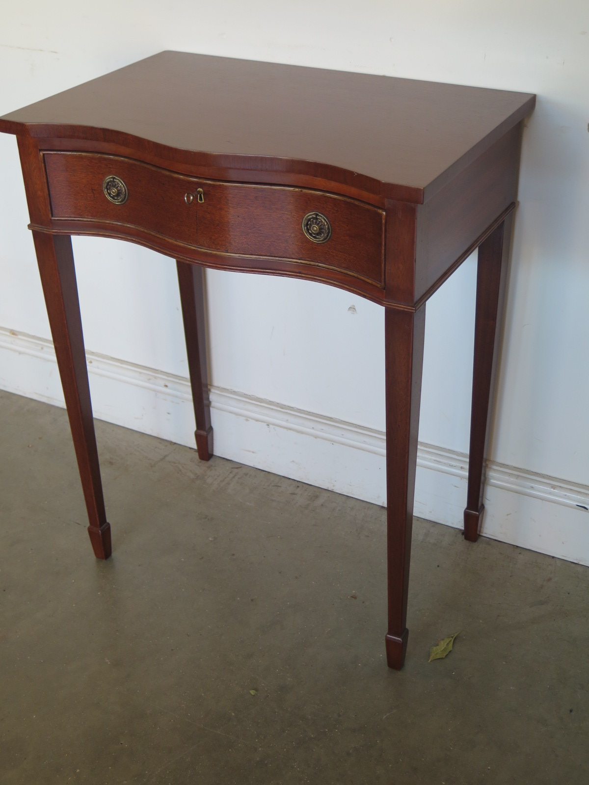 A modern side table with a serpentine front - Width 61cm x Height 77cm - in good condition - Image 2 of 2