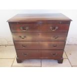 A Georgian mahogany chest with two short over three long drawers on bracket feet and with a