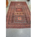 A hand knotted Persian Baluchi rug - 2.40m x 1.