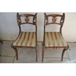 A pair of Regency Faux Rosewood Side Chairs on sabre legs - damage to top of one, other chair good,