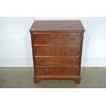 A reproduction 20th Century Walnut Four Drawer Chest - 76 cm tall x 63 cm x 40 cm