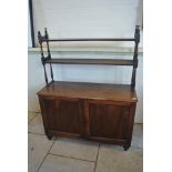 A 19th Century mahogany two door cupboard with a two tier upstand - needs some restoration to