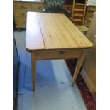 A 19th Century stripped pine kitchen table with a drawer - 75 cm tall x 107 cm x 67 cm