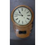 A Light Oak Drop Dial Wall Clock with a 12" painted dial - working in saleroom