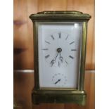 A Brass Carriage Clock - alarm striking on a bell - 12 cm tall - working in saleroom