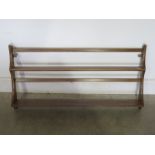 An Ercol Elm Wall Rack - 49 cm x 97 cm