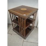 An Edwardian Mahogany inlaid revolving bookcase with shell inlaid top