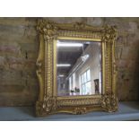 A 19th Century ornate giltwood framed rectangular beveled mirror - frame approx 50 cm x 46 cm