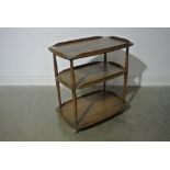 An Ercol Elm Three Tier Tea Trolley - 77 cm tall x 71 cm x 46 cm - in good condition