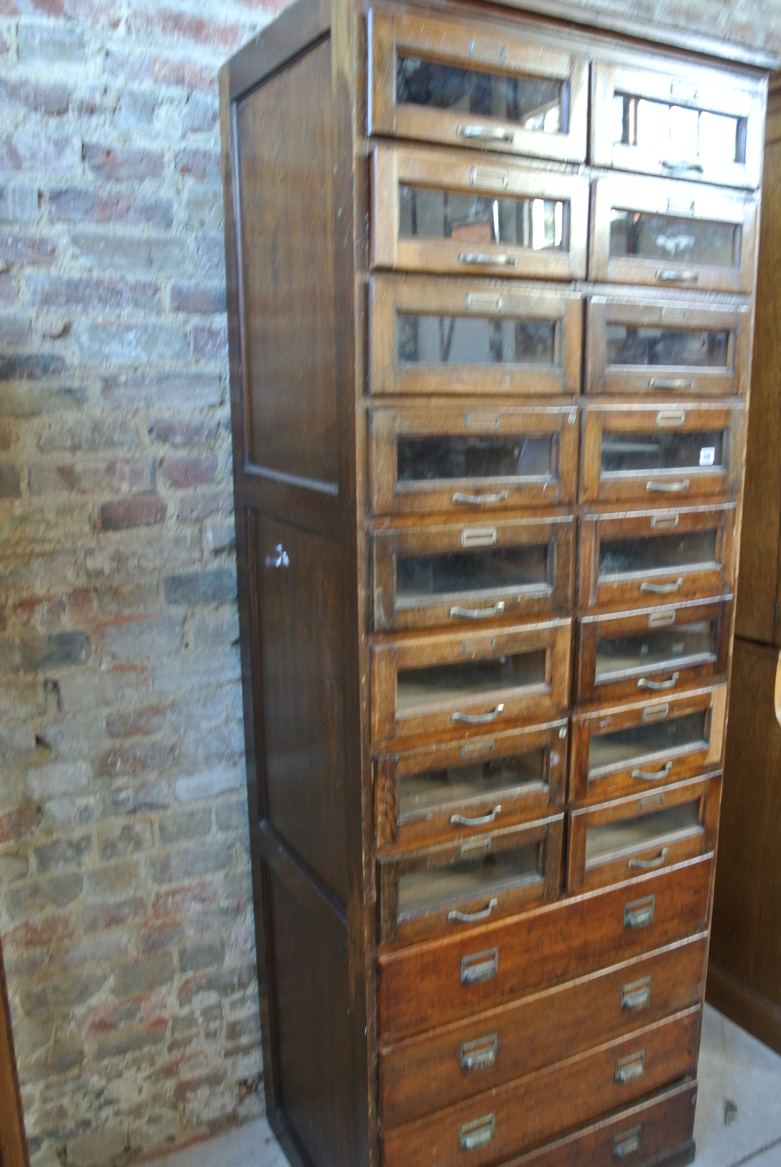 An Oak shop haberdashery cabinet with 16 glazed drawers above 4 long drawer with plywood panelled - Image 2 of 3