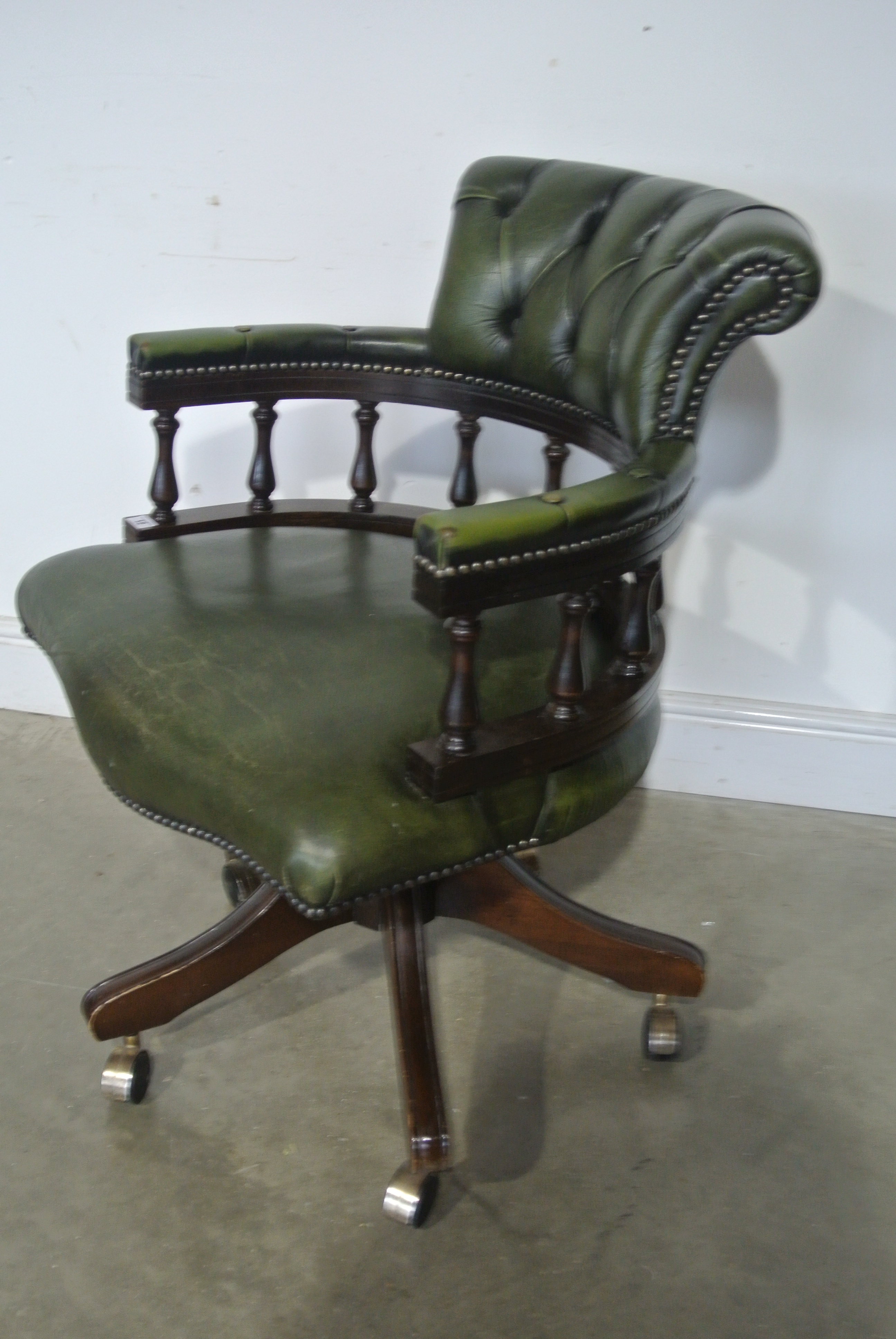 A Reproduction Captains Chair in Green Leather