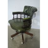 A Reproduction Captains Chair in Green Leather