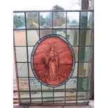 A leaded glazed window panel with a sepia figural central panel - 75 cm x 59 cm - in good condition