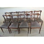 A set of nine 19th Century Rosewood Dining Chairs with carved back rail drop in seats on inverted