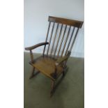 A 19th century ash and elm stick back rocking chair