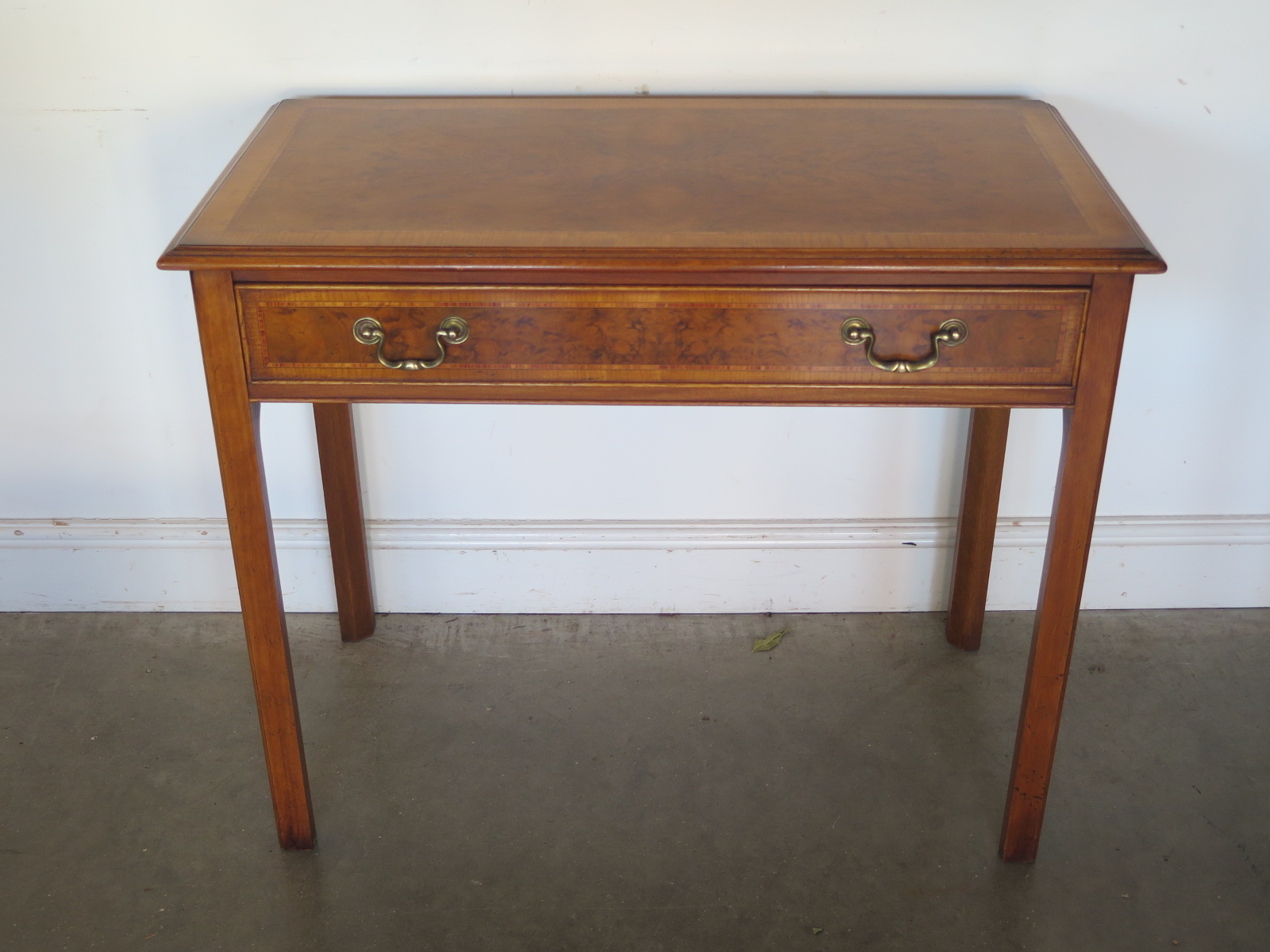 A walnut crossbanded side table with a single drawer - Width 93cm x Depth 48cm x Height 77cm - made