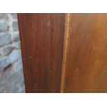 An Oak shop haberdashery cabinet with 16 glazed drawers above 4 long drawer with plywood panelled