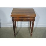 A Victorian style mahogany fold over card table - 73 cm tall,