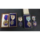 A collection of five silver and enamel Masonic jewel medals - all in good condition except 1934