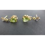 A pair of 9ct Gold Peridot and Diamond Earrings - 2 cm long, approximately 2.