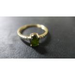 A 9ct Yellow Gold Tourmaline and Diamond Ring - Size R/S - approximately 1.