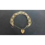 A 9ct Yellow Gold Bracelet with Heart Shaped Clasp,