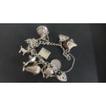 A silver charm bracelet, approx 1.