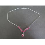 A sterling silver nine stone ruby necklace - Length 45cm - 8 rubies approx 5mm diameter - in good