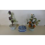 Two Chinese "Fruiting Shrubs" - 23 cm tall - in celadon pots and a blue and white stand - all