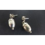 A pair of Georg Jensen silver earrings of acorn form - some light usage wear and scratching