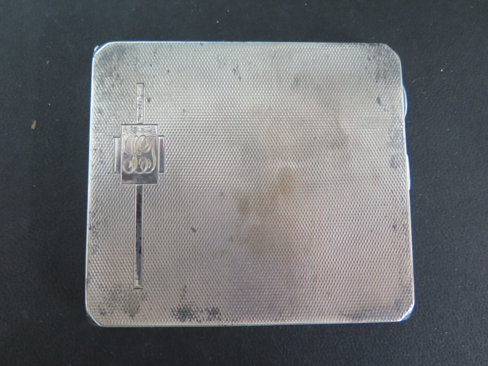 A silver cigarette case - weight approx 3.