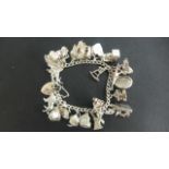 A silver charm bracelet, approx 2.