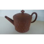 An 18th Century red ware tea-pot and cover,