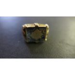 A Gold Ring - believed to be 18ct gold, with engraved decoration - size N - approximately 7.