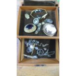 An assortment of costume jewellery in a leather case - handle broken to case