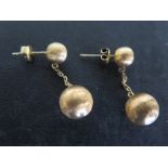 A pair of 14ct yellow gold earrings of spherical form - total approx weight 6.